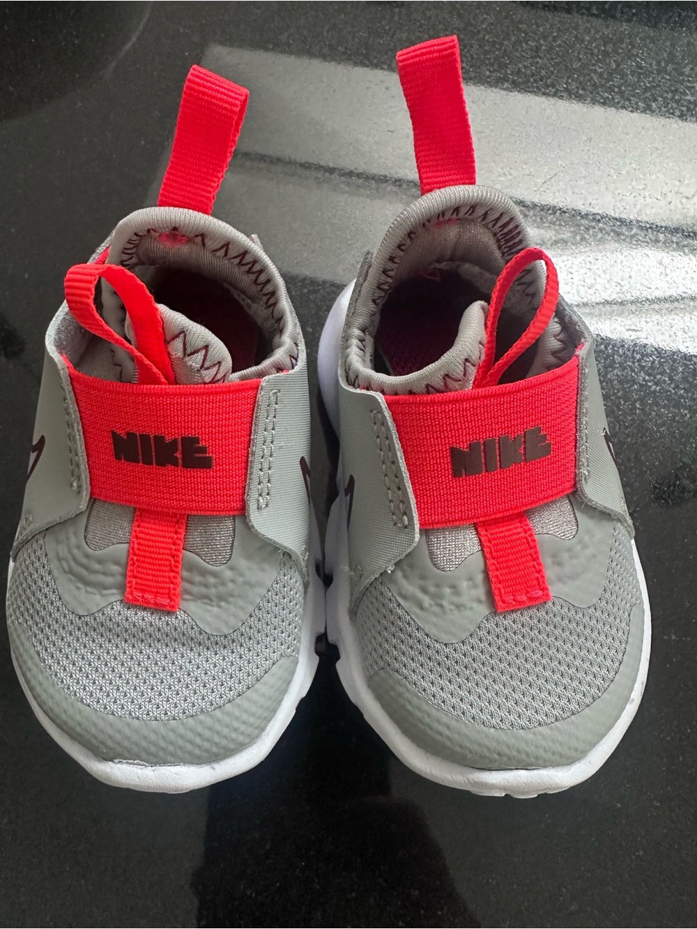 Nike Kids Grey and Red Slip-On Athletic Sneakers